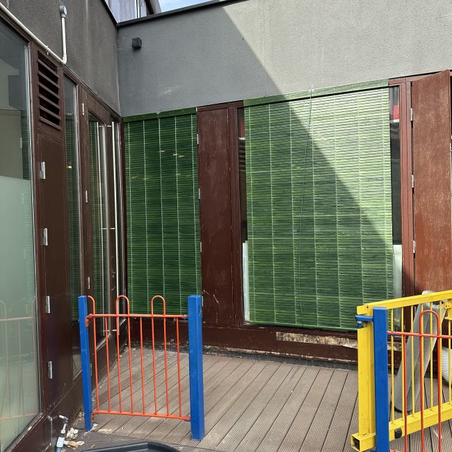 Outdoor green blinds shading playschool